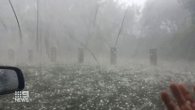 Freak giant hail and flash flooding hit NSW