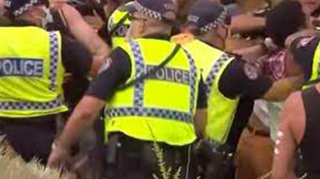 Angry protesters clash with police in Darwin