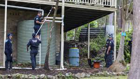 Police divers examine water tank at home