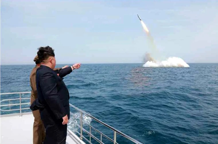 North Korea’s Kim watches cruise missile